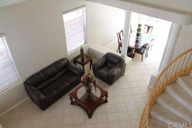 View looking down into the living and dining room.