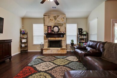 Living room featuring dark wood finished floors, 