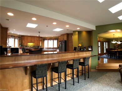 Living room also has bar seating area.