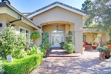 Lush courtyard entry, stamped concrete, beveled gl