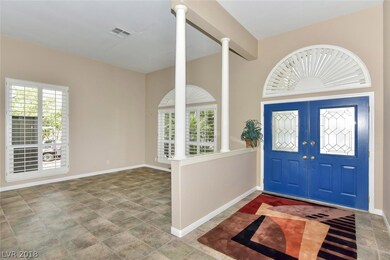 DOUBLE DOOR ENTRY INTO LARGE FOYER.