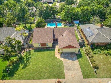 Street view looking into backyard with pool.