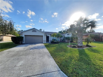 Single story home with stucco siding, concrete dri