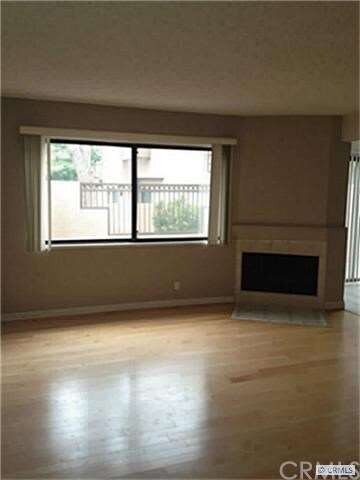 Family room has a romantic fireplace and is very l