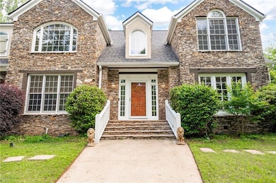 Two story entry with custom pine work and reclaimed beams
