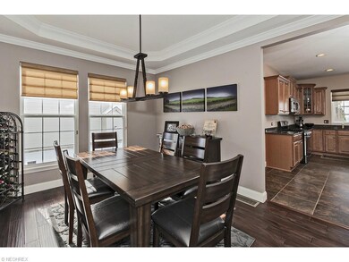Formal dining room with tray ceiling leads to the 