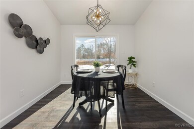 Dining room with dark hardwood / wood-style floors