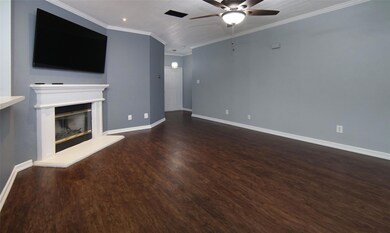 Unfurnished living room with dark wood-type floori
