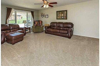 Living Room. The warm neutral carpet is plush and 