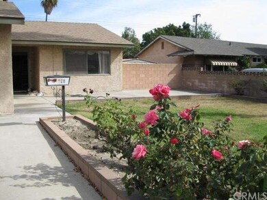 Welcoming planter leads to entry