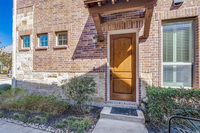 View of exterior entry featuring brick siding