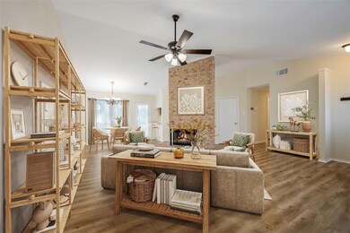 Virtually staged view of living/dining rooms