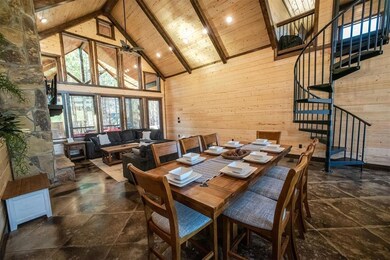 Dining area featuring ceiling fan, wooden ceiling,