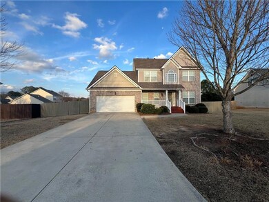 View of front of house featuring brick siding, an 