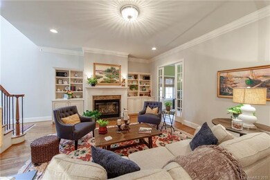 Living room with built-ins and gas fireplace.