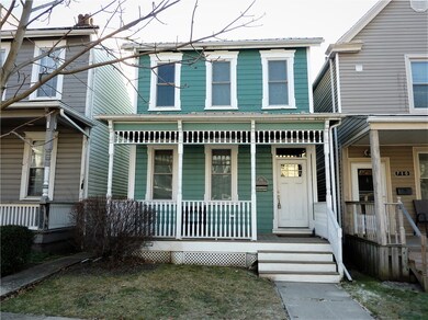 Welcoming Front Porch with Wood Ceiling