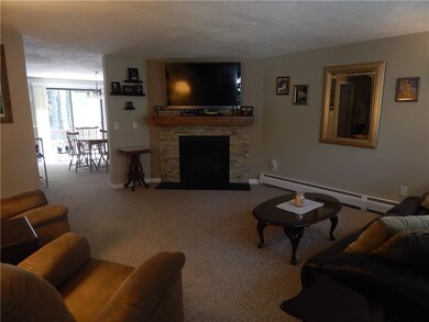 Warm & inviting living room with striking fireplac