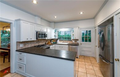 Sleek updated kitchen with stainless appliances, r