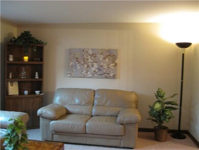 Living Room. NEW WALL TO WALL CARPETING.