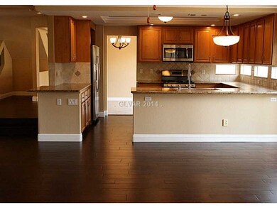 Property Photo. FAMILY ROOM LOOKING INTO KITHCHEN