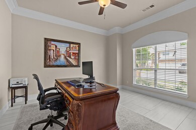 Office featuring visible vents, a ceiling fan, bas