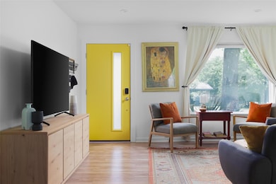 Sitting room featuring light wood-style floors