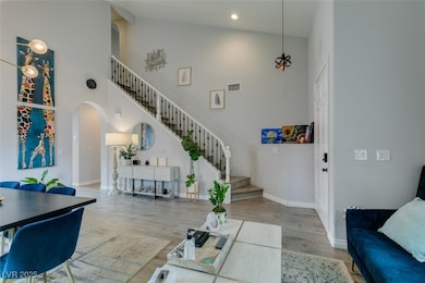 Dining area featuring a notable chandelier, high v