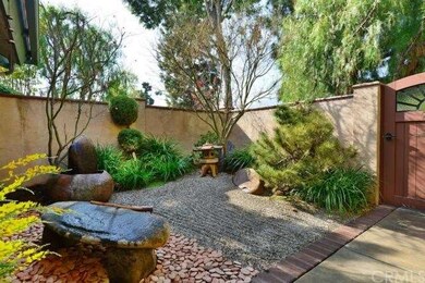 Gated Zen garden out front