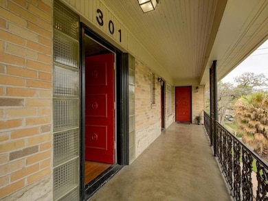 Entrance to property featuring brick siding