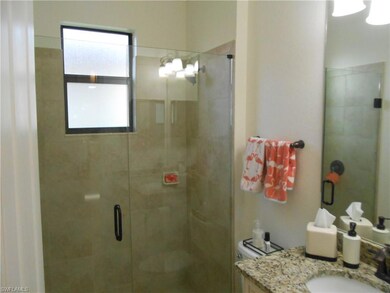 Bathroom featuring vanity and walk in shower