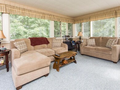 Sun Room with windows inviting the...