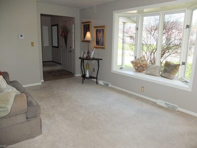 Formal living room with bay window.