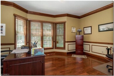 Den/Office with hardwood floors, crown molding and