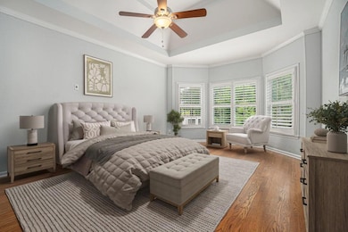 The Main Level Primary Suite is a luxurious retreat with a Tray Ceiling, Spa-Inspired Bathroom with a Soaking Tub, Separate Shower, Dual Vanity, and a Massive Walk-In Closet.