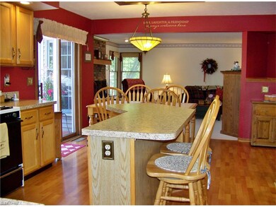 Kitchen view to family room and slider to deck