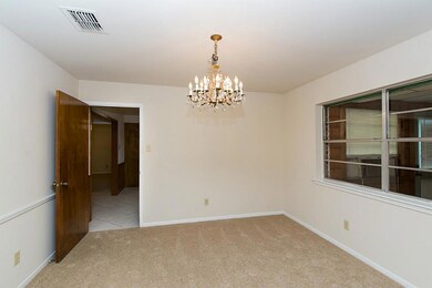 Dining room has fresh paint and new carpet
