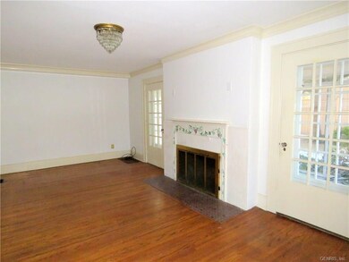 Living Room with Hardwoods . . .Woodburning Firepl