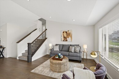 Main level living room open to dining area and kitchen