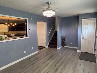 Additional living room picture featuring the ceiling light and fan