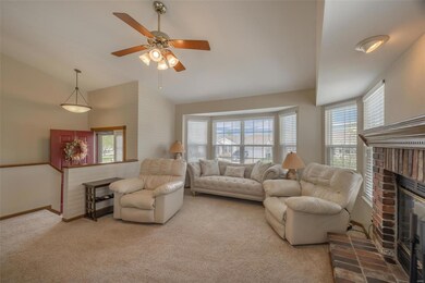 Large great room with beautiful bayed windows and 