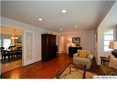 Living room opens to dining area and 1st of three 