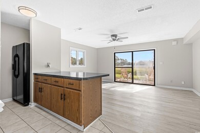 Kitchen featuring black fridge, a wealth of natura