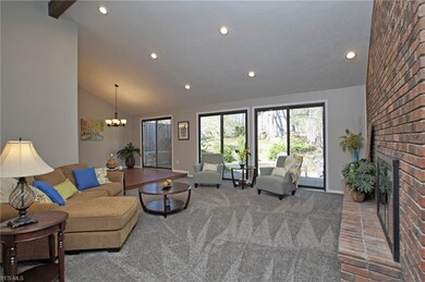 Vaulted great room with sliders to the private bac