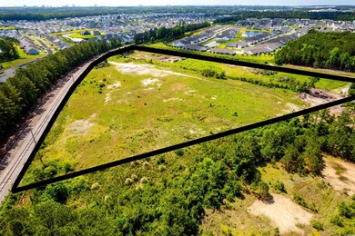 Aerial view of residential area featuring property boundaries highlighted