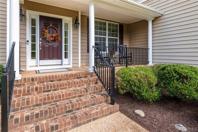 View of exterior entry aggregate walkway featuring