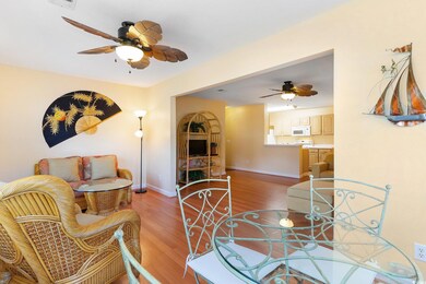 Dining space with a ceiling fan, light wood finished floors, and baseboards