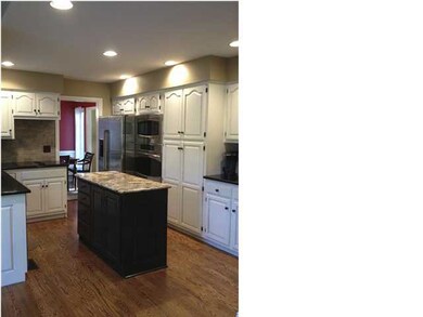 Kitchen also has stainless appliances.
