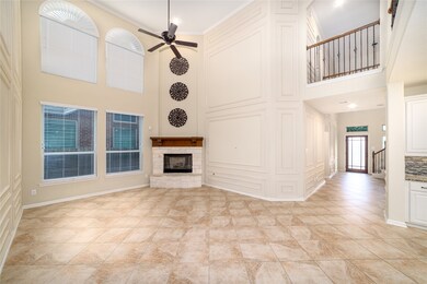 The spacious living room features soaring ceilings