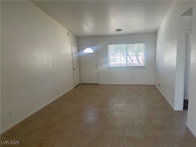Foyer entrance with baseboards