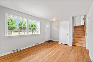 Unfurnished room with plenty of natural light and light hardwood / wood-style flooring